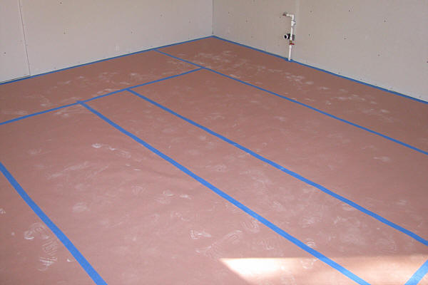 Rosin Paper Taped Down to Protect Floors