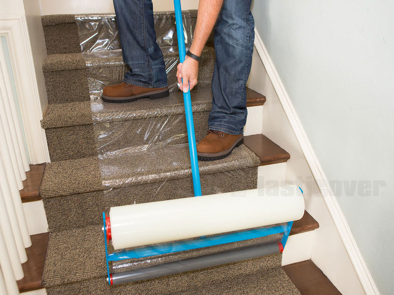Carpet protection film being installed on carpeted stairs with a film applicator