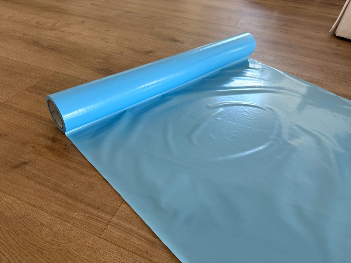 6 mil Fire Retardant Film Rolling out on Hardwood