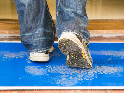 Sticky mat removing dirt fromt shoes at home entrance